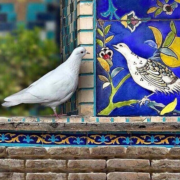 Iranian art- a bird examining a tile with a bird motif 🇮🇷