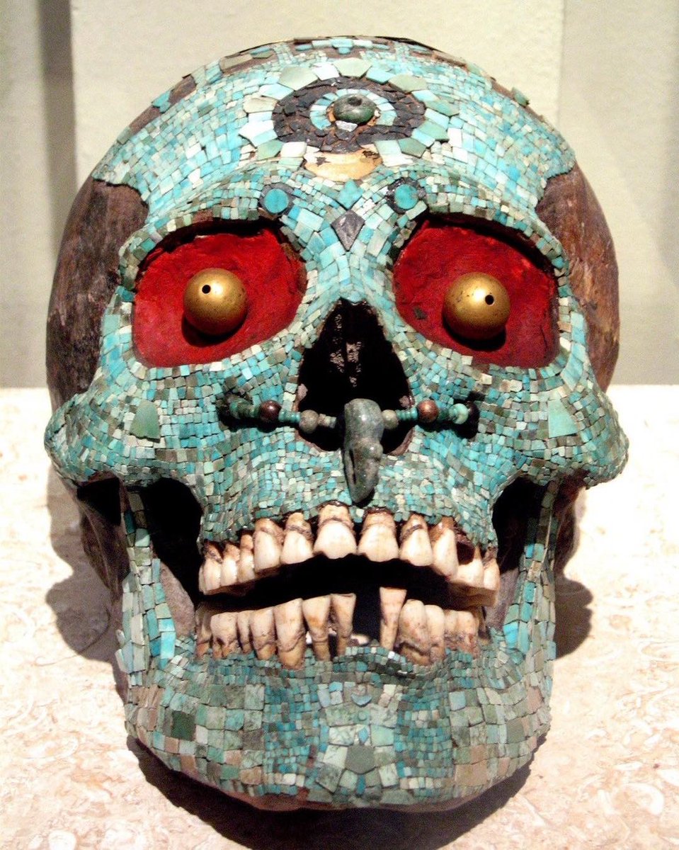 An Aztec skull from Tonalá covered with turqoise mosaic, gold eyes and a jade ornament in the forehead. 1300-1521 CE.

This mosaic is believed to represent the god Tezcatlipoca, or “Smoking Mirror,” one of four powerful creator deities, who were amongst the most important gods in