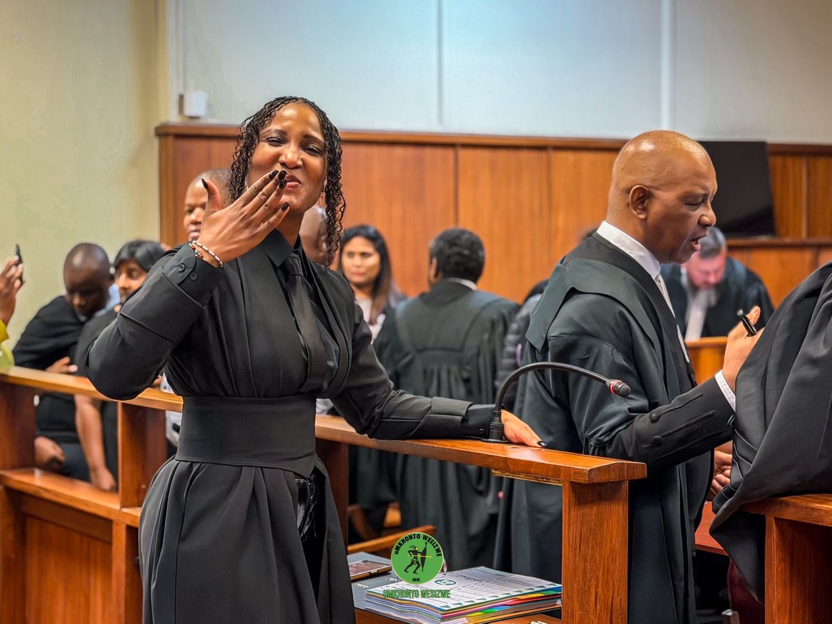 Shezwethu's tweet image. Even in the courtroom, the spirit remains high! Hon. Duduzile Zuma-Sambudla sharing smiles and gratitude with the comrades. We are supported by Second Deputy President Cde Tony Yengeni and Head of Presidency Magasela Mzobe. Amandla!! #weseeyou