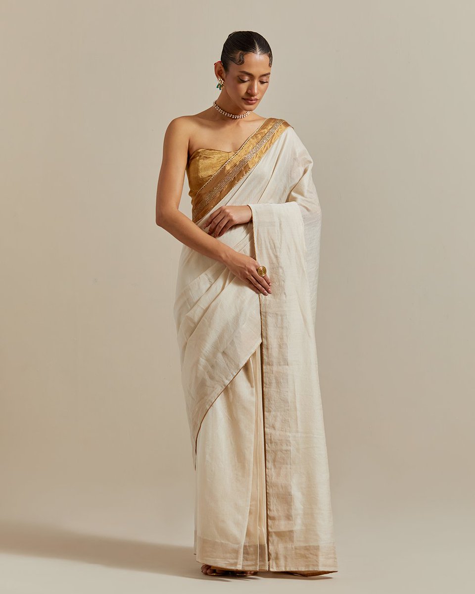 Vinusto's tweet photo. Timeless elegance for destination weddings! 👑✨

The Vinusto Ivory &amp; Gold Chanderi Saree with cut-dana lace &amp; zari silk corset blouse is perfect for ethnic yet bold vibes. 💛🤍💫

🌸 Explore: https://t.co/5vmP1QpKxV

#DestinationWeddings #EthnicElegance #Vinusto https://t.co/jGPsvuwO1d