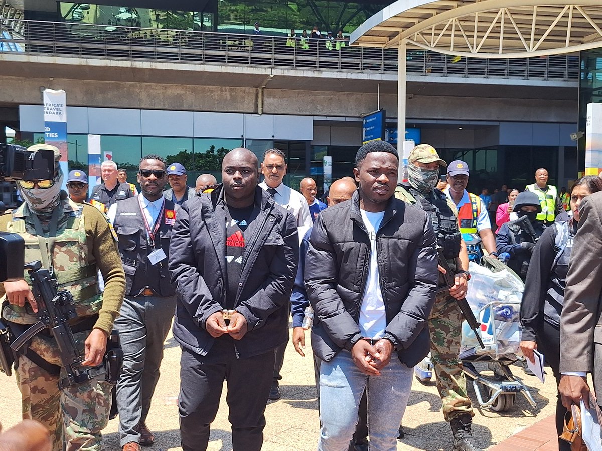 DriesLiebenberg's tweet image. Alleged #AKA hitmen Siyabonga and Malusi #Ndimande escotted in handcufs to eaiting Nyala armoured car at #Durban airport. They have been extradicted by eSwatini and flown to Durban on a charter plane. Being charged with 2023 murder of rapper AKA #sabcnews