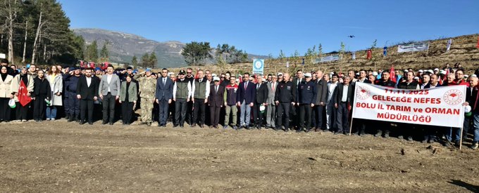 First image shows a line of adults in formal and casual attire standing in front of a banner that reads Bolu İl Millî Eğitim Müdürlüğü on a dirt area with mountains and trees in the background. Second image depicts a large crowd of people including children and adults gathered on a hillside with Turkish flags, a fire truck, and banners near pine trees and a dirt mound. Third image is a collage with panels showing groups of people on a dirt field, some holding flags, others planting trees, and a clear blue sky with mountains. Fourth image is another collage featuring close-ups of individuals including a man in a suit and woman in red jacket planting saplings with shovels and watering cans on a dirt plot surrounded by trees and a crowd in the distance.
