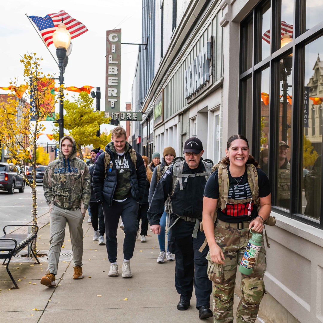 Ashland_Univ's tweet photo. On Veterans Day, we honor the courage and sacrifice of all who have served. Last week, AU’s Office of Military Family &amp; Veteran Services hosted the second annual G.W.O.T. Ruck Walk—a 3.1-mile march through campus and the City of Ashland honoring all veterans and service members. https://t.co/8fU8AVl3x5