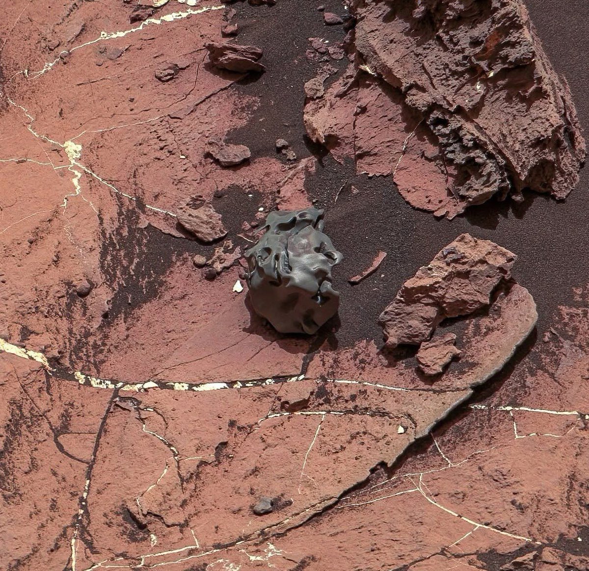 This is a meteorite.

Resting on Mars.

Captured by a robot explorer sent by humans.

225 million miles from home. 🚀🔴