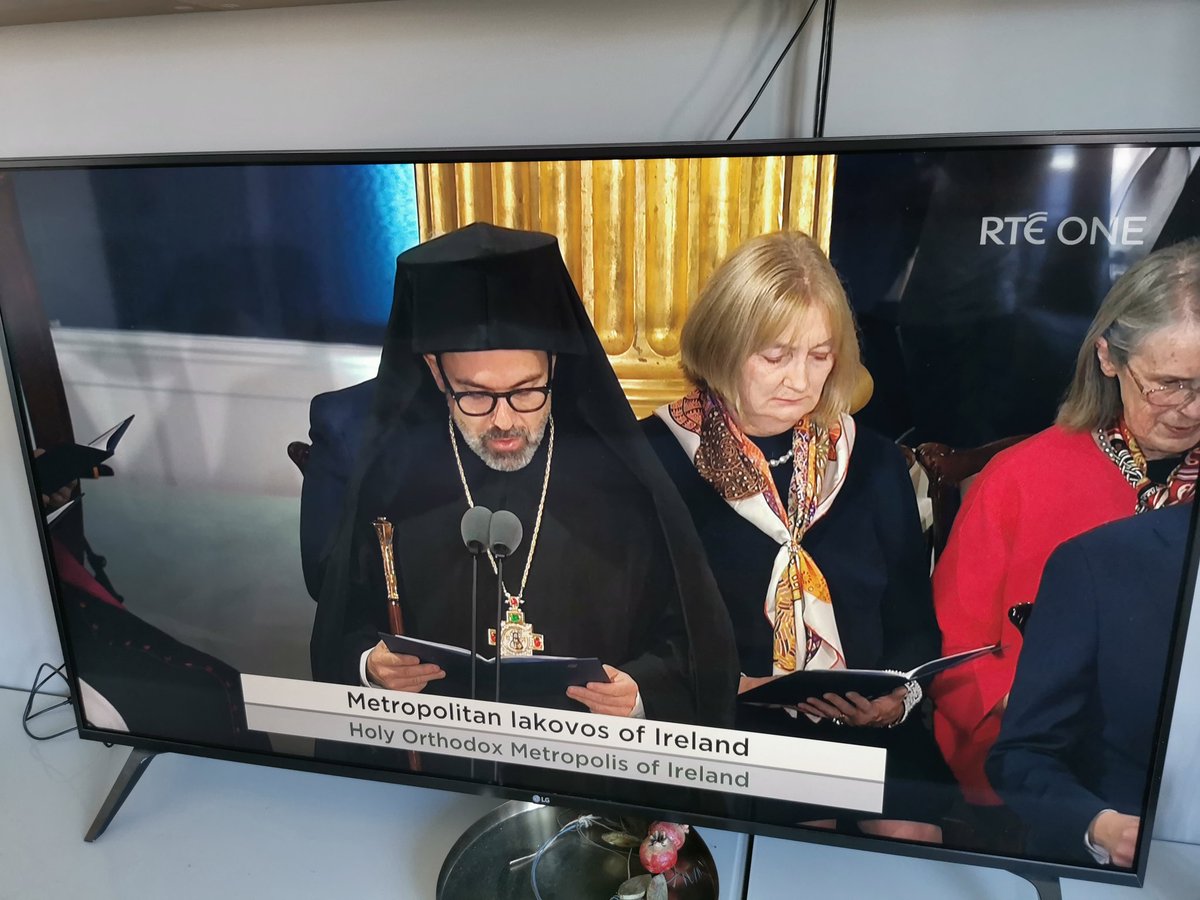 Greek Orthodox Metropolitan Iakovos of Ireland reads a prayer at the inauguration of Ireland's new President Catherine Connolly.