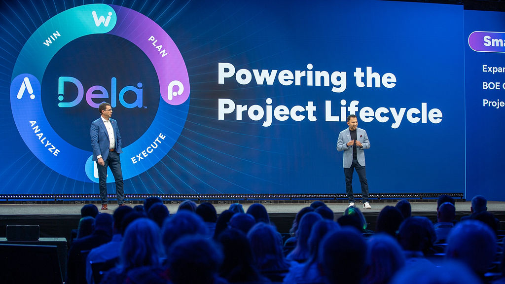 Deltek's tweet image. Today at #DeltekProjectCon, members of our leadership team took the stage to share a glimpse into how the future of Deltek is ‘Elevated by Design’ 🏔️

A new era of Deltek is here... stay tuned 👀