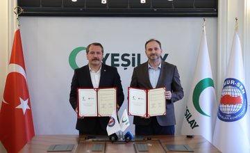 First image shows two men in suits sitting at a table with Turkish flags, Yeşilay logo on wall, documents and microphones present, one man signing a paper. Second image depicts a group of eight people including men and women some in hijabs around a long table with Turkish, EU, and Yeşilay flags, documents and water glasses on table. Third image features two men in suits holding signed documents with flags including Turkish, Yeşilay, and international organization banners in background. Fourth image shows a group of eight people standing around a long table with Yeşilay logo, Turkish flag, and other banners, individuals in formal attire including suits and hijabs.