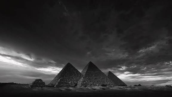 Bones...... are made of Calcium, the main ingredient in concrete. I believe the Great Pyramids of Giza are indeed a tomb, but the pyramids themselves are the tomb of billions of skeletons. "Made of living stone..." poured concrete blocks, made with the bones of entire races.