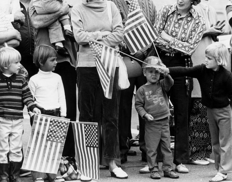 LAPublicLibrary's tweet image. The Library will be closed today, November 11, 2025, in observance of Veterans Day. Visit us at lapl.org for online resources and information.

[1991] Young patriots display flags during the Veteran&apos;s Day parade in Long Beach.