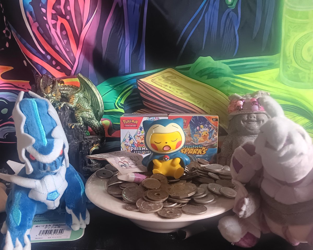 My shrine. Money from around the world. The dragon spews incense.