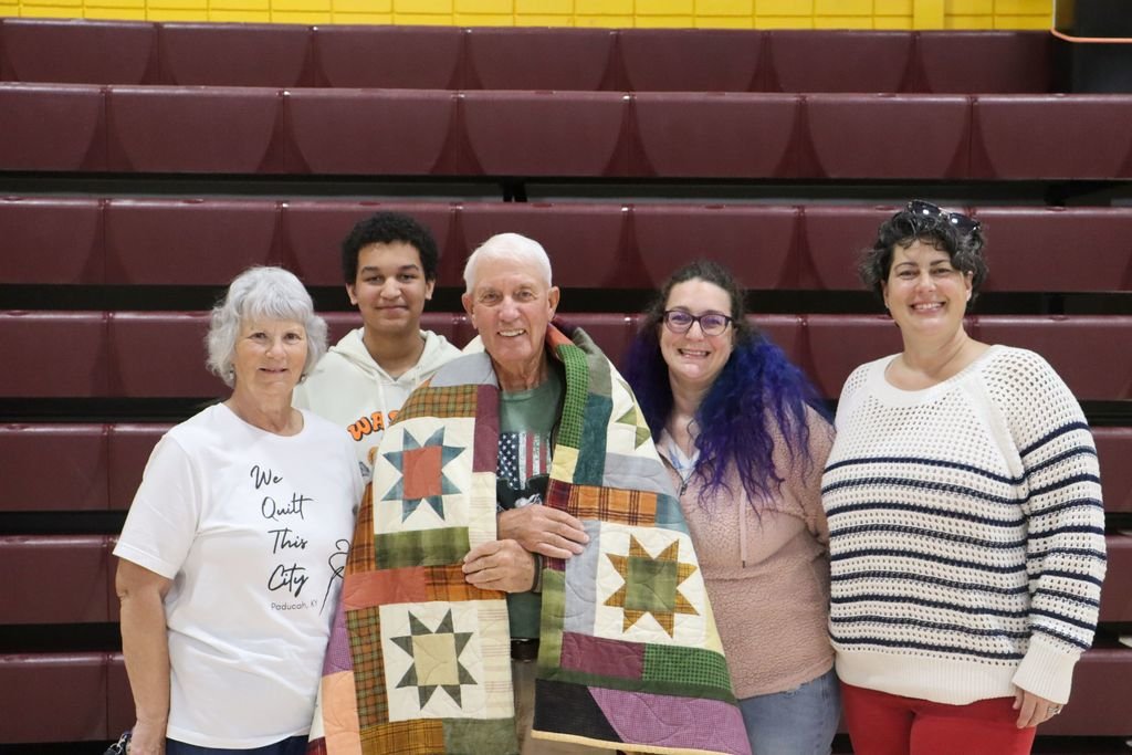 MennoWolves's tweet image. At our Veterans Day Program 14 Veterans received either a Quilt of Valor or a Quilt of Honor. Four Quilts of Valor were given out and ten Quilts of Honor were given out. Pictured are various recipients and their families.