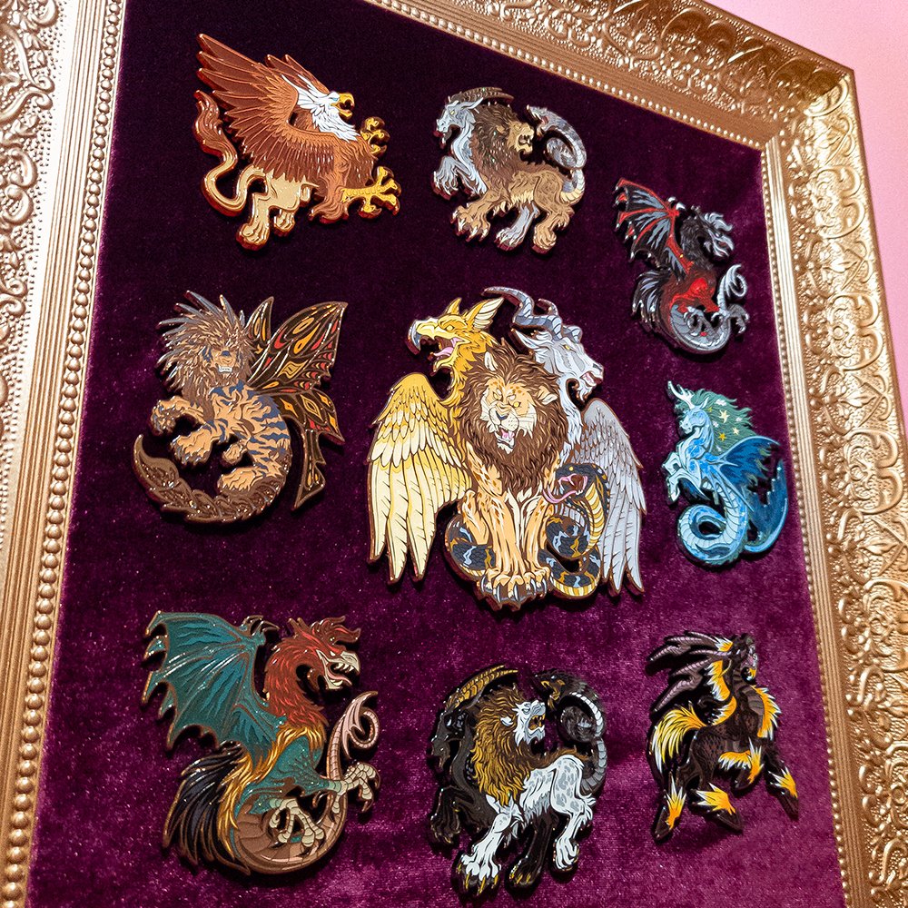 My CHIMERA pins came in and they're stunning in person! I made this golden framed pinboard to showcase my favorites on 💛