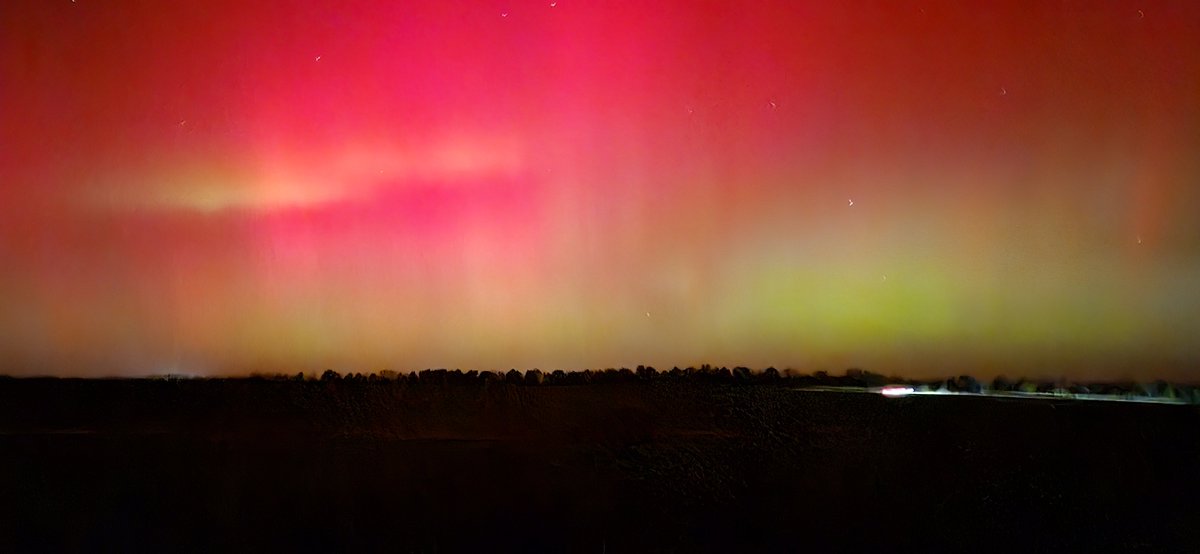 I was out putting away chickens when I saw a huge red light in the sky. I dropped what I was doing and stumbled in the dark through my woods to see what it was. I took this Pic with the nighttime setting on my phone. I'm in central Missouri.