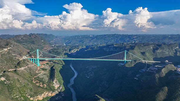 DeccanChronicle's tweet image. The 758-meter-long Hongqi Bridge on National Highway 317 in #China&apos;s Sichuan Province partially collapsed on November 11, 2025, due to a #landslide  from mountain slope deformation near the #ShuangjiangkouHydropowerStation. 
Authorities detected cracks and closed the bridge to…