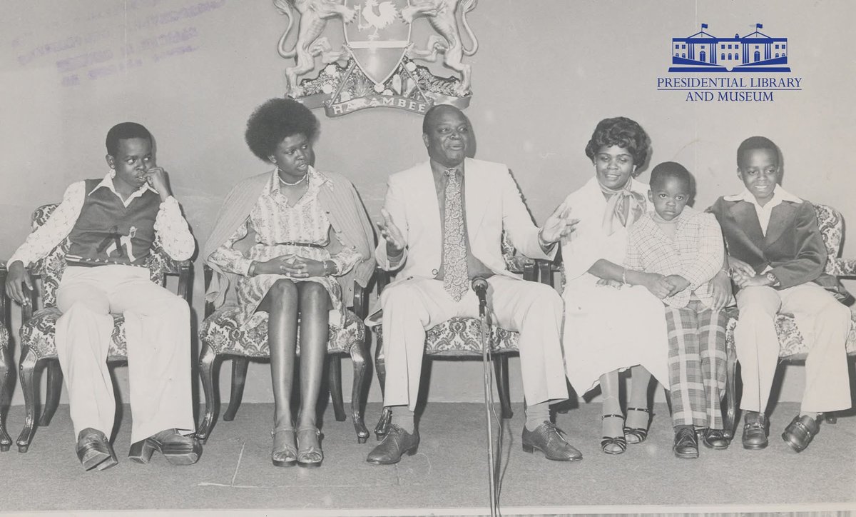 KResearcher's tweet image. Mwai Kibaki with his family. On the left is Jimmy. Focus on his shoes,they were popularly known as &quot;platforms&quot;. Young men loved them with their large heels.
