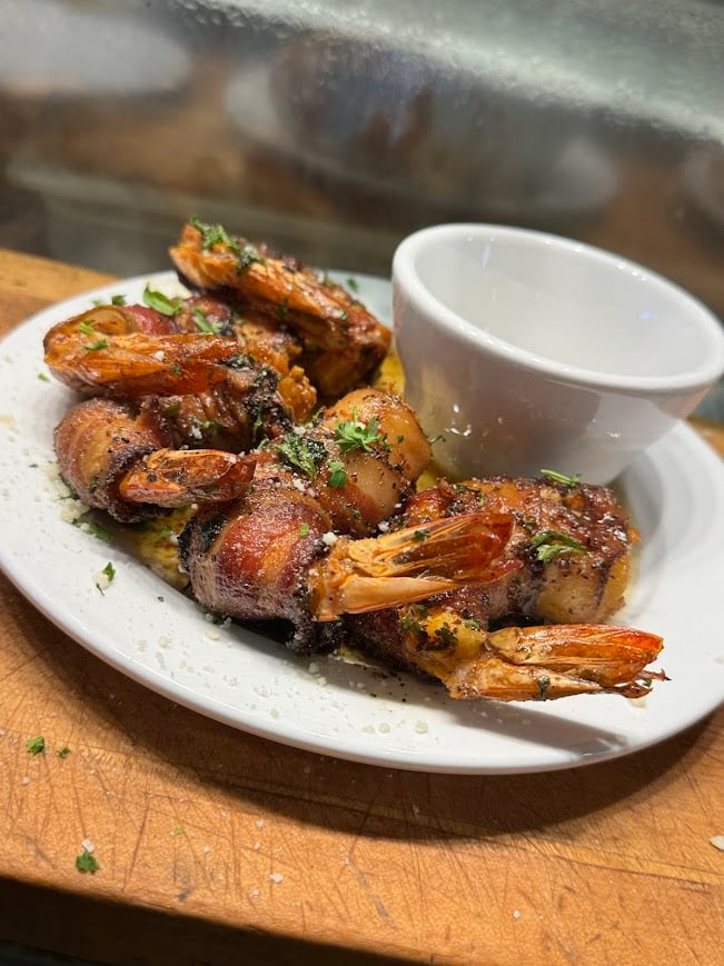 Can't get enough of our Bacon Wrapped Crab Stuffed Shrimp? 🍤🥓 You're not alone! This dish is a crowd favorite. Come taste what the buzz is all about! #4thBaseRestaurant #BaconLovers #SeafoodSensation