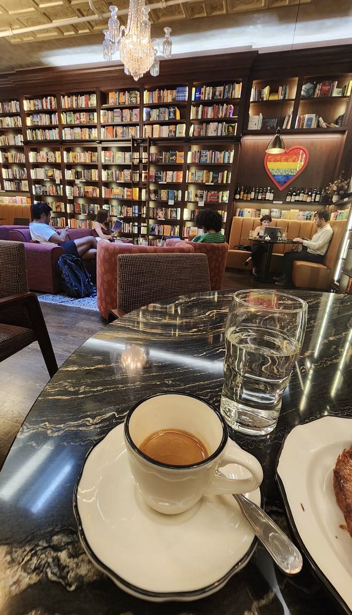 nextokens's tweet image. At the lefty library/coffee shop. Croissant  and a large latte for 15 bucks. BIPOC author section. Pride flag heart. I let the staff know everything’s delicious. They say thanks. If they overheard me and @maninthemarina discussing our views they’d happily see us killed