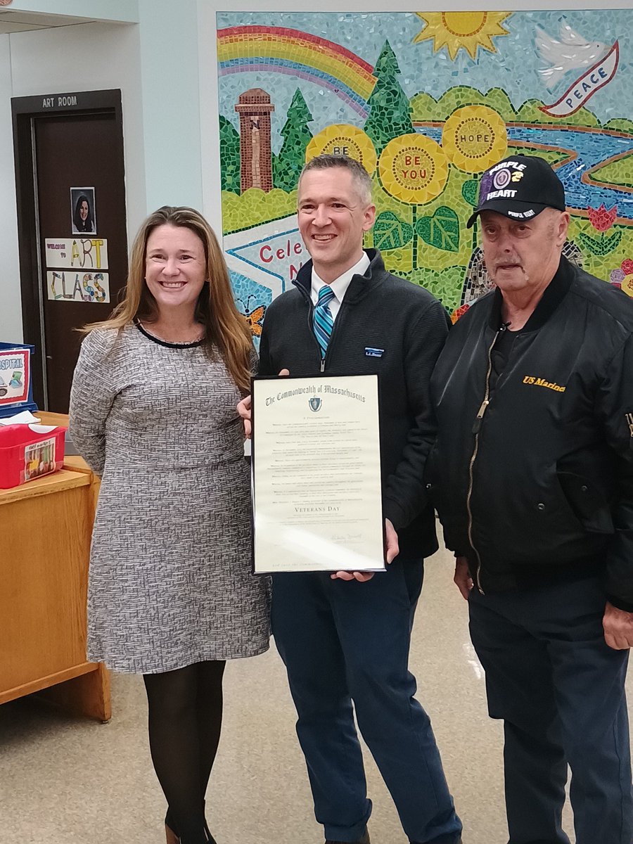 A shot of Norton High School history teacher holding up a proclamation from the state after being recognized by the Norton School Committee for his role as grand marshal in the Norton Veterans Day Parade
<a href="/NHSLancersports/">Norton Lancer Athletics</a> <a href="/RPStevens1176/">Robert Stevens</a> <a href="/NortonSchools/">Norton Public Schools</a> <a href="/joneill727/">Jen O'Neill</a> <a href="/NPSHISTORY1/">NHS History/Social Studies</a>
