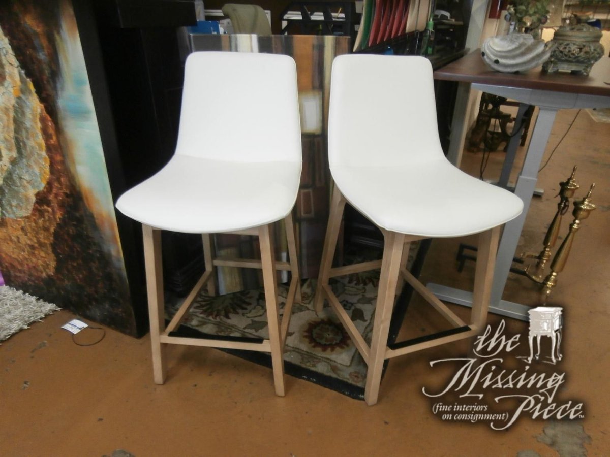Elevate your kitchen or bar with this set of two Noble Bar Stools. Crafted with genuine white leather and sturdy mango wood legs, it exudes luxury and durability. Measures 25"H.  
Click here for pricing and availability ➡ buff.ly/QaySuny