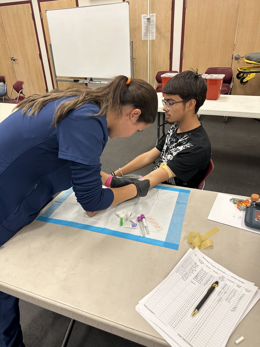 MrsKthummel's tweet photo. PCT Students drawing blood 🩸 at Family Night. Each student accomplished 10 successful vein sticks !! https://t.co/jKwnny4Ulb
