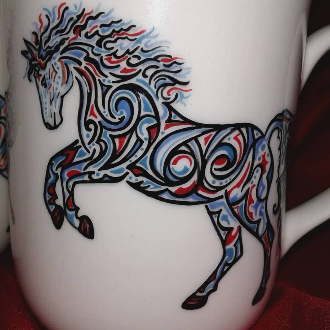 Ceramic mug version some years ago. 
Can you find the word painted into the design?