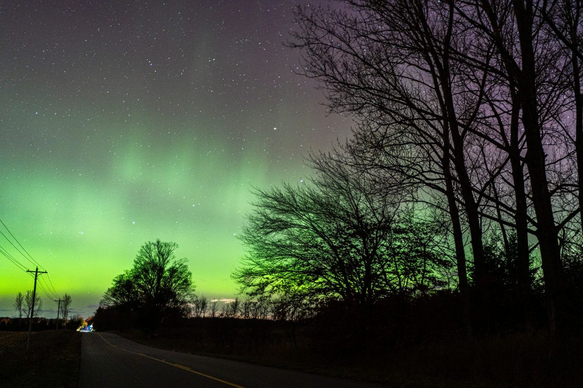 The northern lights, or aurora borealis, glow above the Little Sable Point Lighthouse in Mears, Michigan, late Wednesday after a powerful solar flare struck Earth shortly after sunset. bit.ly/3Lv50NJ

Photos by Finn Gomez, <a href="/freep/">Detroit Free Press</a>