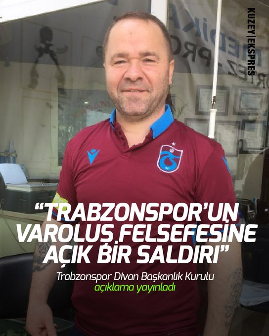 A middle-aged man with short hair and a beard stands indoors near a wooden table and chairs, wearing a maroon short-sleeved polo shirt with a blue collar and Trabzonspor club logo on the chest, smiling slightly at the camera, with overlaid Turkish text about Trabzonspor philosophy and a disciplinary statement.