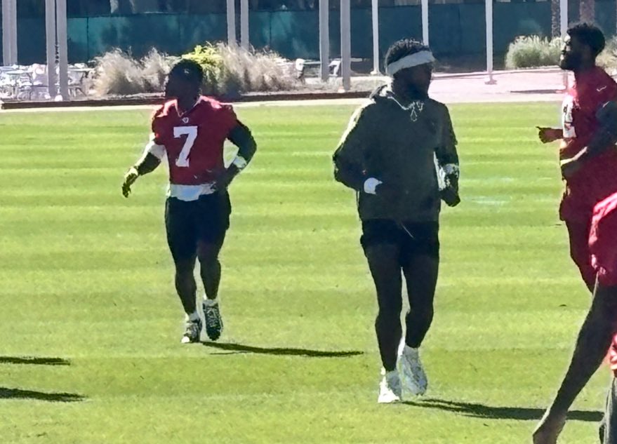gregauman's tweet image. Here it is: Bucky Irving (7) and Chris Godwin (headband) both going through warmups at today’s practice after long injury absences.
