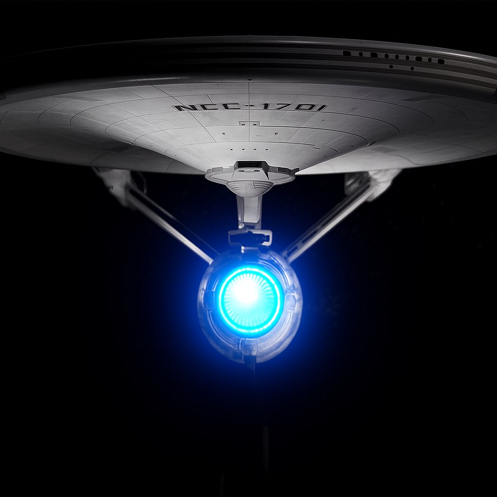 My 1/350 Scale Refit Enterprise from Polar Lights. Just messing with some photo additions taken after the shoot (change to black and white with the blue glow of the deflector).