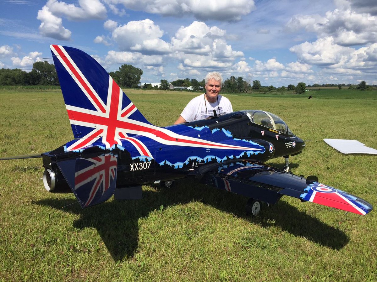 RowanCreates's tweet image. These remote control jets are fun toys.  
Here is one that I painted.
The customer is posing with it in this photo.
Then he brought in 3 more RC jets for me to paint.  
Nice guy.