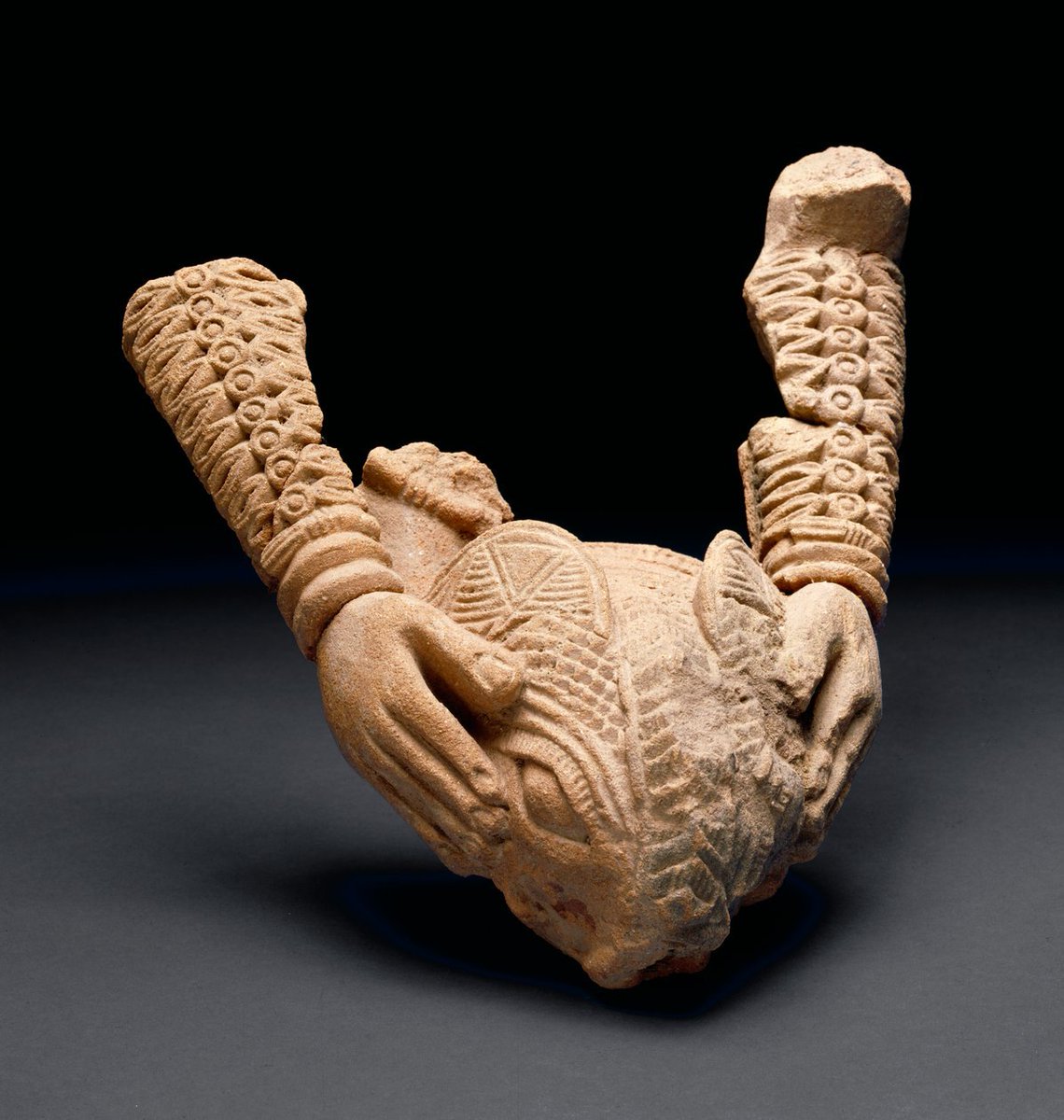 Terracotta sculpture of human arms holding an animal's head,  from the Owo Kingdom of Yorubaland (🇳🇬)  

Dating back to the 15th century