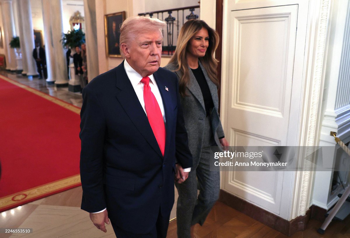 President Donald Trump and First Lady Melania Trump arrive for the signing ceremony for the "Fostering the Future" executive order in the East Room of the White House