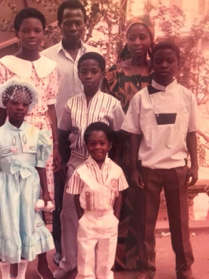 From front to back; Flowking Stone, Okyeame Kwame behind me, our Snr brother Boat on OK’s left, our sis Ama on his right. Mum and Dad behind us with a cousin. Kunta wasn’t born at this time. Pic taking after church 
Listen to #Familypicture here 👉🏾 audiomack.com/flowking-stone…
