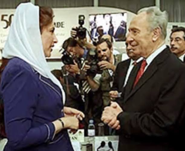 Since we are talking about handshakes…. Picture of Late PM Benazir Bhutto with then Israeli President Shimon Peres.