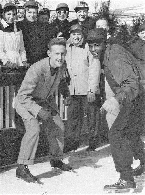 Vin Scully and Jackie Robinson ready to race on ice skates at Grossinger's Resort in the Catskills, New York, where the Dodgers trained. The race came about when Robinson, who had never ice skated before, challenged Scully to a race. Scully, who had skated for years, recalled