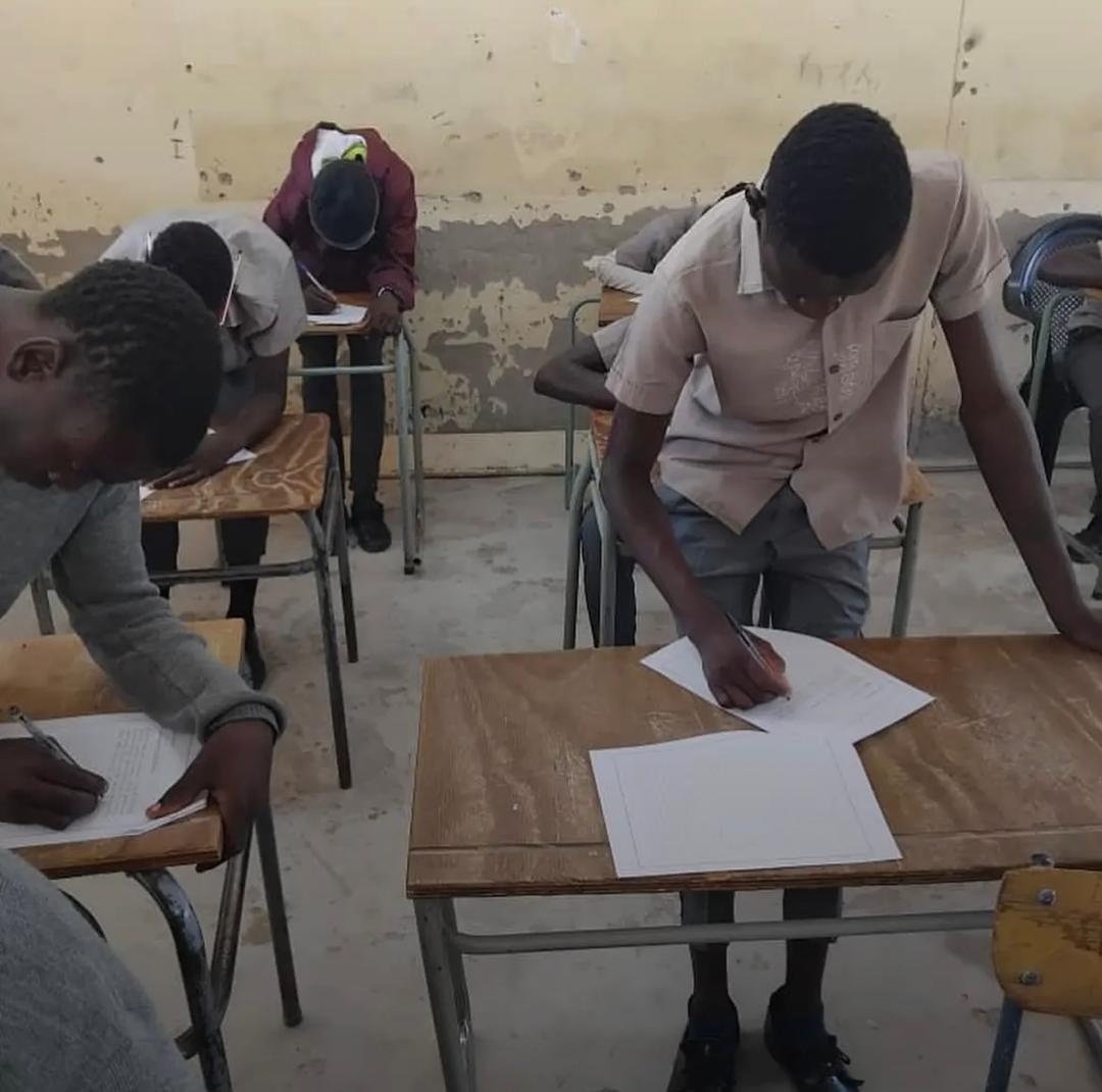 WRITING EXAMS STANDING ... Some Grade 8 pupils at Katjinakatji Senior Secondary School are writing their current final exams without proper chairs or desks, forcing them to stand or sit on broken furniture, a situation that has angered community members. Kavango West regional