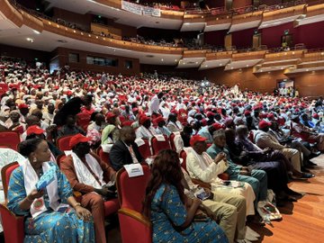 First image shows a stage with banners for 12ème Congrès Confédération Nationale des Syndicats du Sénégal CNTS theme Les défis du travail et la migration on November 8 and 9 2025 at Grand Théâtre speakers at podium with microphones chairs and flags. Second image depicts a large audience in an auditorium many wearing red attire seated attentively in rows with wooden floors and red seats. Third image features three people standing in a modern office with Turkish and Senegalese flags decorative wall art and Turkish Republic Dakar Embassy sign two men in suits and one woman in black dress. Fourth image displays stage setup similar to first with speaker at podium raising fist banners for CNTS congress theme and participants seated nearby.