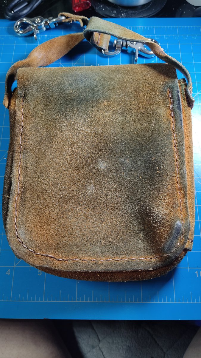 This bag is going to replace this one I made over 10 years ago made out of brown suede. What it looked like when I finished it and now. It's just too small to hold my phone, smokes, extra mag, flashlight and pen.