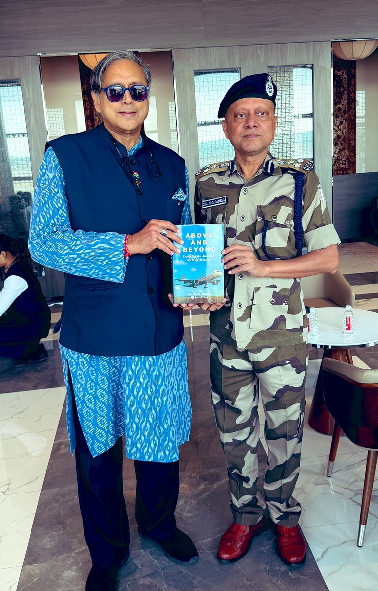 ShashiTharoor's tweet photo. Before leaving Hyderabad I was delighted to meet @cisf DIG SK Mohanka, who is a fount of knowledge and insight on airport operations, from security to passenger services. He presented me a copy of his book “Above and Beyond” in which he has truly gone above and beyond the demands of his formal role to explore the world of commercial aviation for the lay reader. I look forward to learning more about the subject after gleaning many insights from our fascinating conversation!
