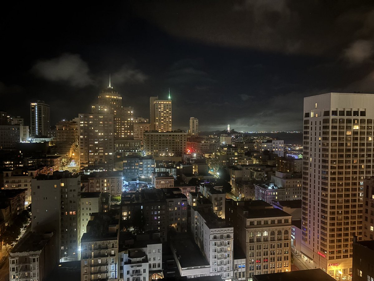 AndrewAbranches's tweet image. When day withdraws its golden, lingering hand  
And dusk ascends behind the urban frame,  
A hush prevails across this storied land;  
The city’s pulse is softened, never tame.
From high-rise windows, squares of light appear,  
Each one a hearth—unseen, yet warm and real—  
And…