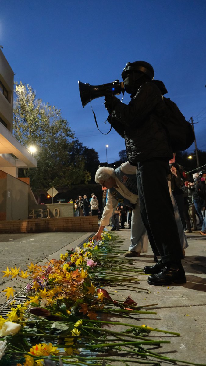 epicurus519's tweet photo. Portland Veterans Day 2025: Veterans lay flowers at ICE's doorstep in a silent memorial for ICE's victims. https://t.co/ydCrjHCIM6