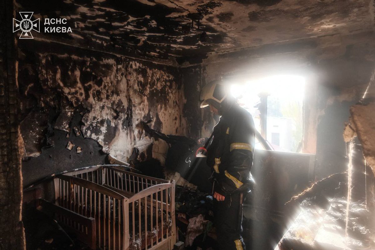 Serhiy Vlasenko is a rescuer from Kyiv. In the photo, he is standing among the ruins of his apartment, which was destroyed by Russia last night.

Last night, Serhiy was on duty.
A Russian drone crashed into the building where he lived with his family.
The apartment that was full