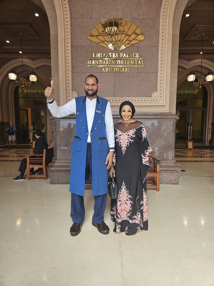So, here I am , standing next to  Abdul Jabbar,  a concierge at the Emirates Palace Mandarin Oriental Hotel in Abu Dhabi, known for his exceptional height of nearly 7 feet 6 inches, He is most likely the tallest man in the Emirates.
Abdul Jabbar has been the face of Emirates
