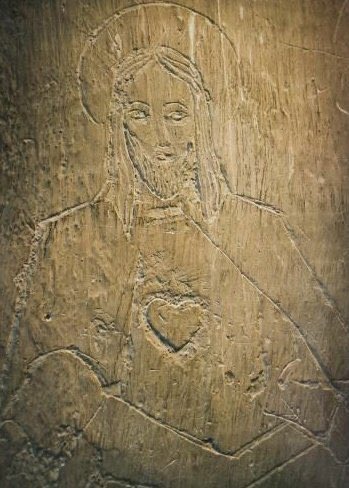 The Sacred Heart of Jesus was carved into the wall of Cell 21 in Block 11 of Auschwitz by Stefan Jasienski, a Polish Catholic, who scratched the image using nothing but his fingernails.