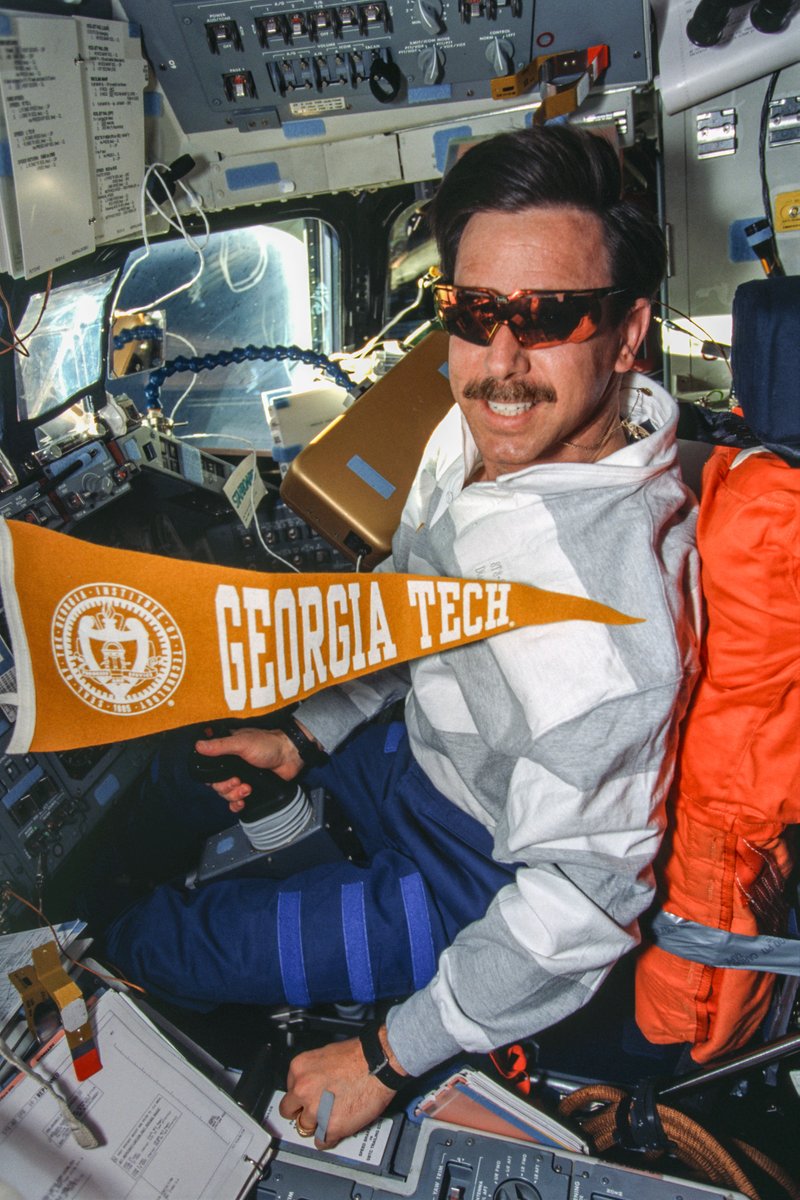 gtalumni's tweet image. Georgia Tech alumnus Scott &quot;Doc&quot; Horowitz brought a Georgia Tech banner with him during four of his space flights. On one, he even brought a photo of his wife and daughter in front of Tech Tower.