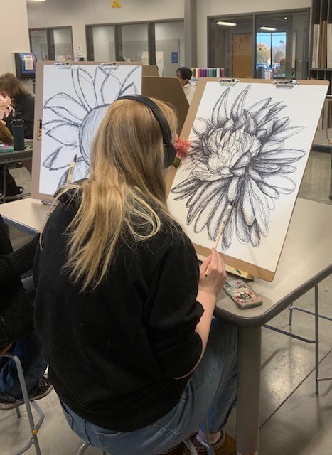 Our Advanced Drawing &amp; Painting students used extended drawing tools (Sharpies attached to dowel rods) to create large‑scale flower studies from observation. They focused on loosening up, exploring gesture, and developing personal mark‑making styles.
