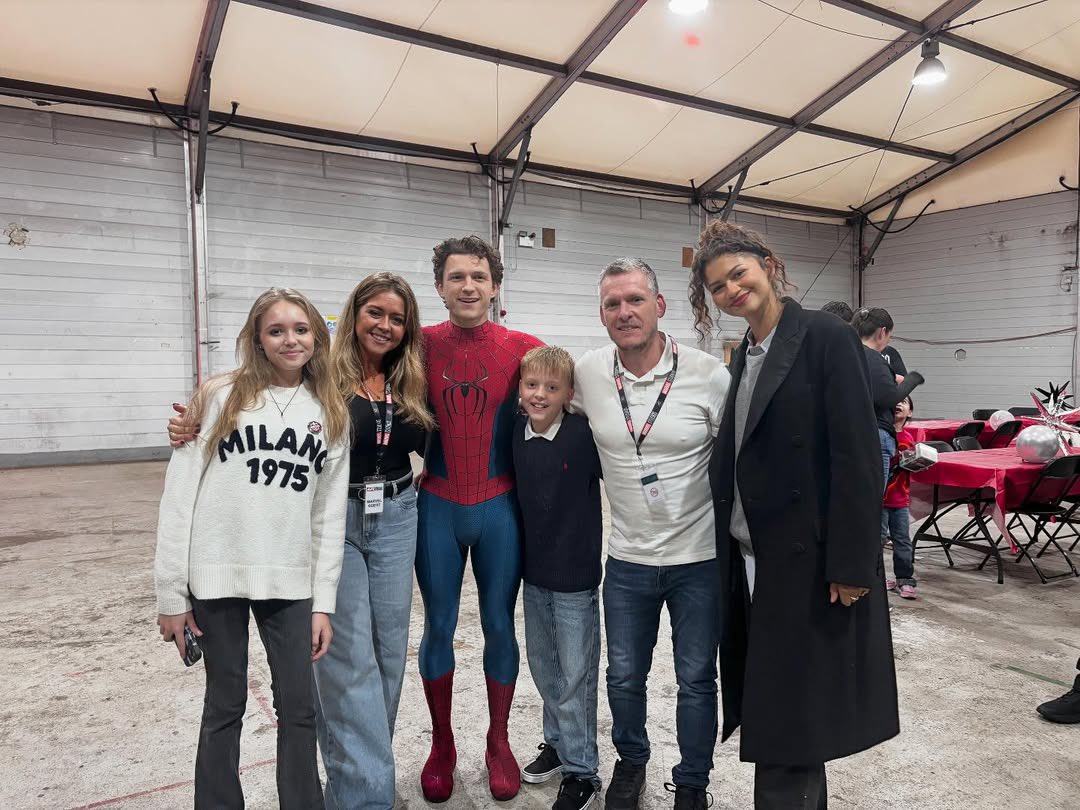 newly released photo of @Zendaya and tom holland getting photographed  together with fans at pinewood studio in london, england