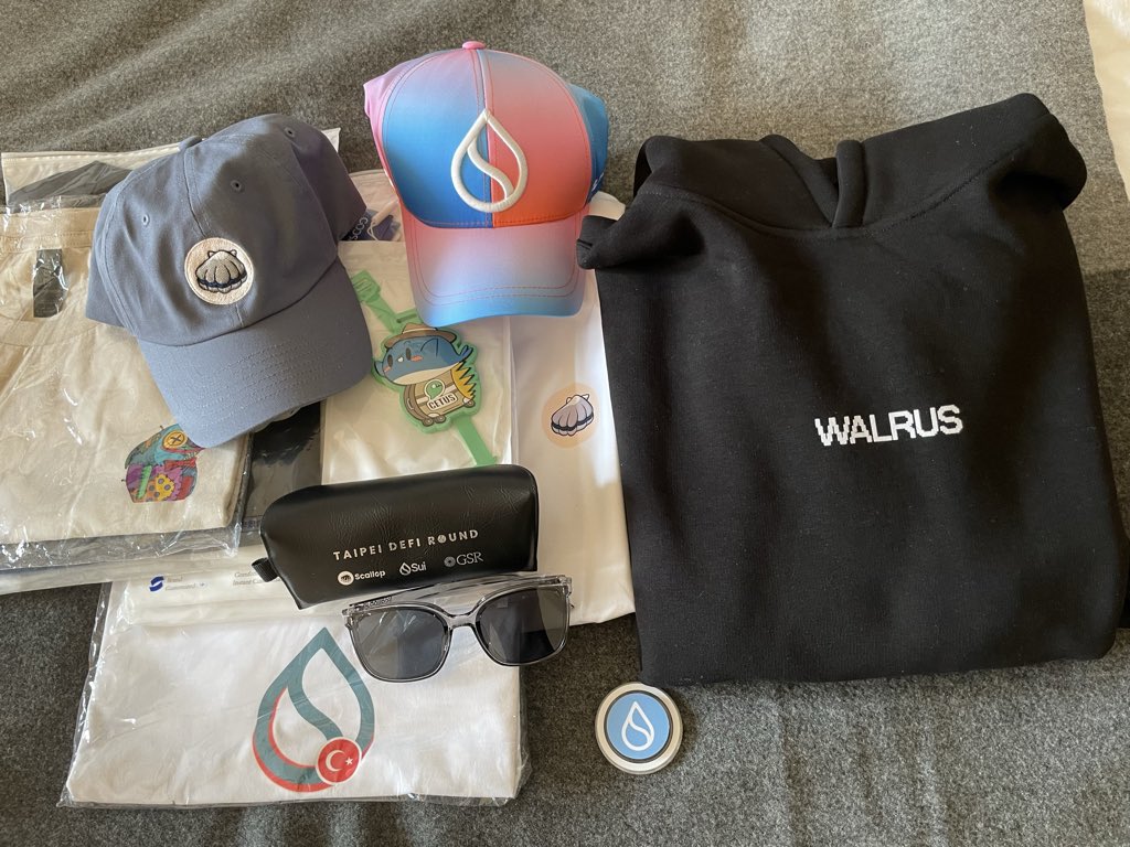 Preparing a <a href="/SuiNetwork/">Sui</a> care package for a friend. Do you think he’ll like these?
<a href="/Scallop_io/">Scallop</a> hat, Tshirt, sunglasses 🕶️<a href="/WalrusProtocol/">Walrus 🦭/acc</a> hoodie, Tshirts from <a href="/CetusProtocol/">Cetus🐳</a> , <a href="/blubsui/">BLUB</a> and <a href="/SuiNetwork_TR/">Sui Türkiye 🇹🇷</a> and more 😁 Missing $BRAT swag! Wen <a href="/bratonsui/">BRAT🌭</a> 🌭