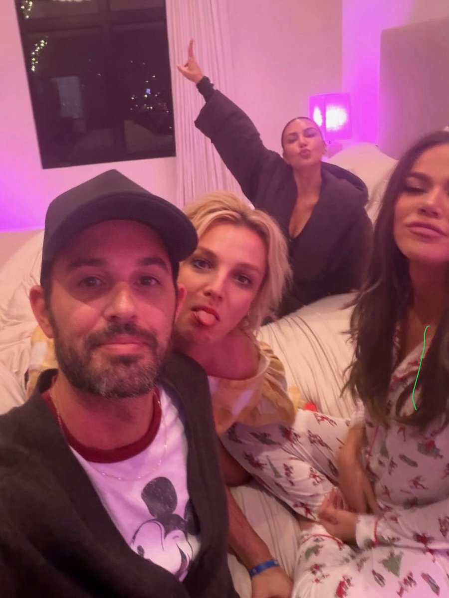 Britney Spears curls up for a slumber party with Kim and Khloé Kardashian and Cade Hudson.