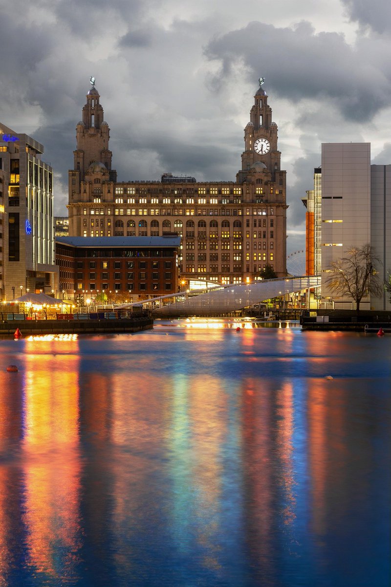 Colourful waters of Prince's Dock, Liverpool on a grey day.
